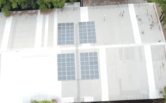 Drone photo: four solar arrays on a metal roof